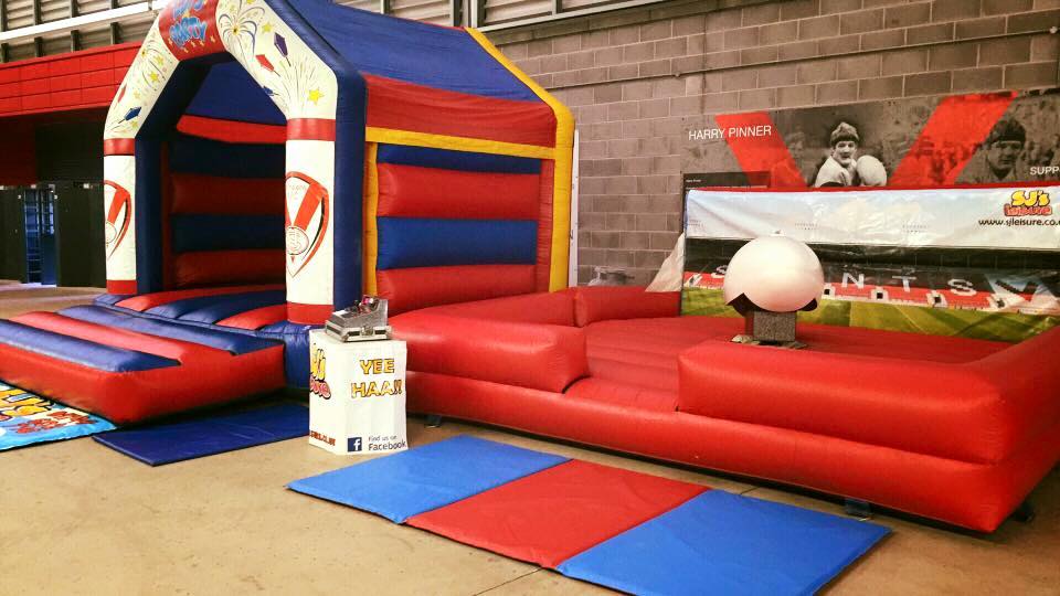 Large bouncy castle and rodeo rugby ball on hire at St Helens RLFC.