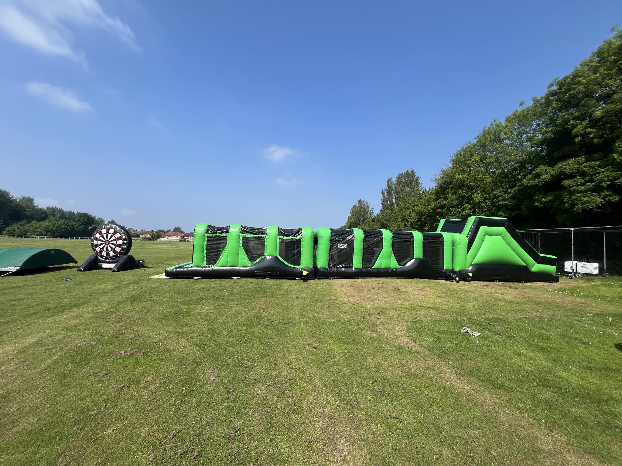 This image shows a three piece obstacle course and small velcro football dartboard set up in Liverpool for the AMEY annual fun day This image shows a three piece obstacle course and small velcro football dartboard set up in Liverpool for the AMEY annual fun day