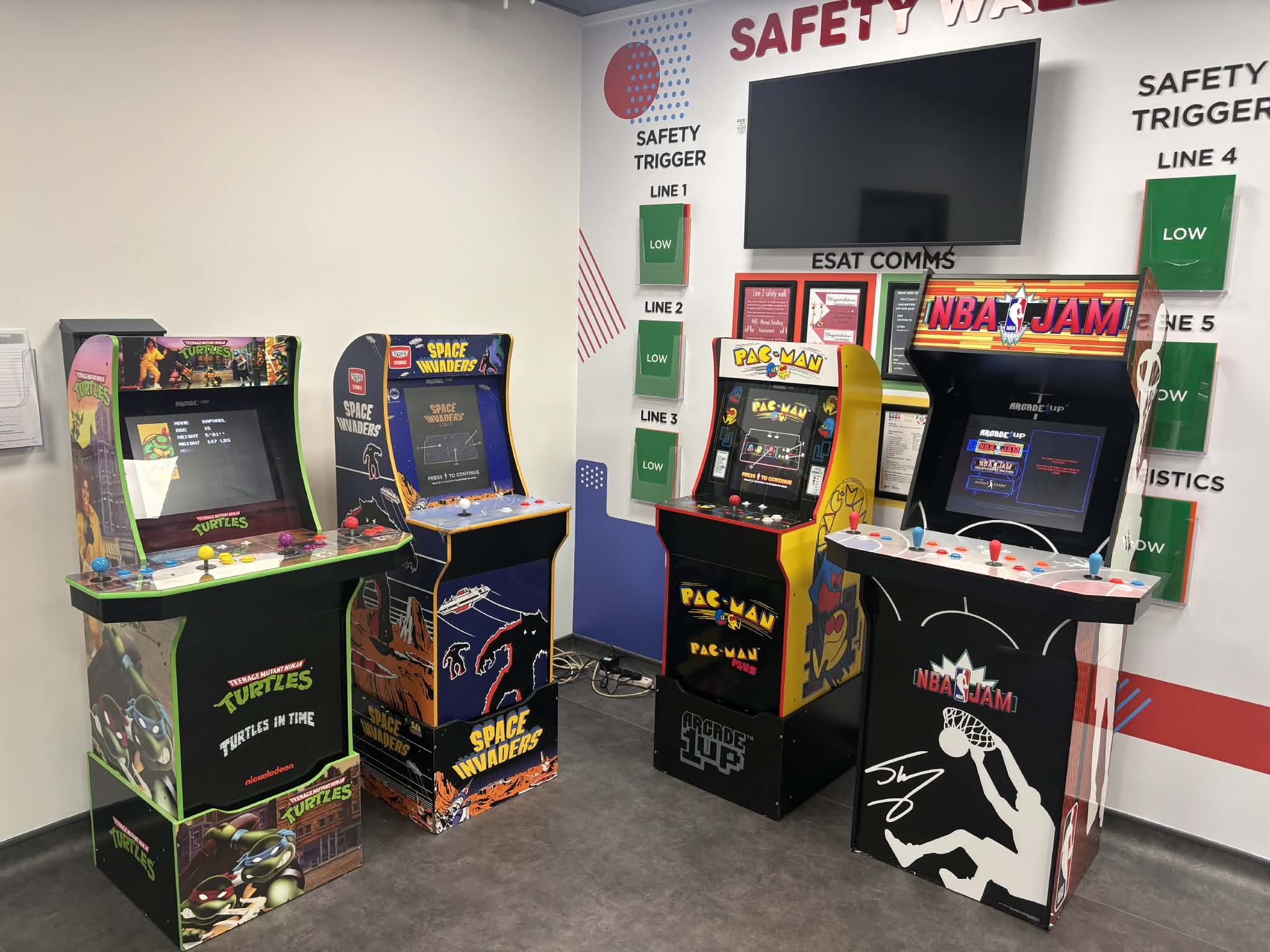 An image of four arcade machines set up at Walkers Snack Foods in Skelmersdale, Lancashire for a staff wellbeing event