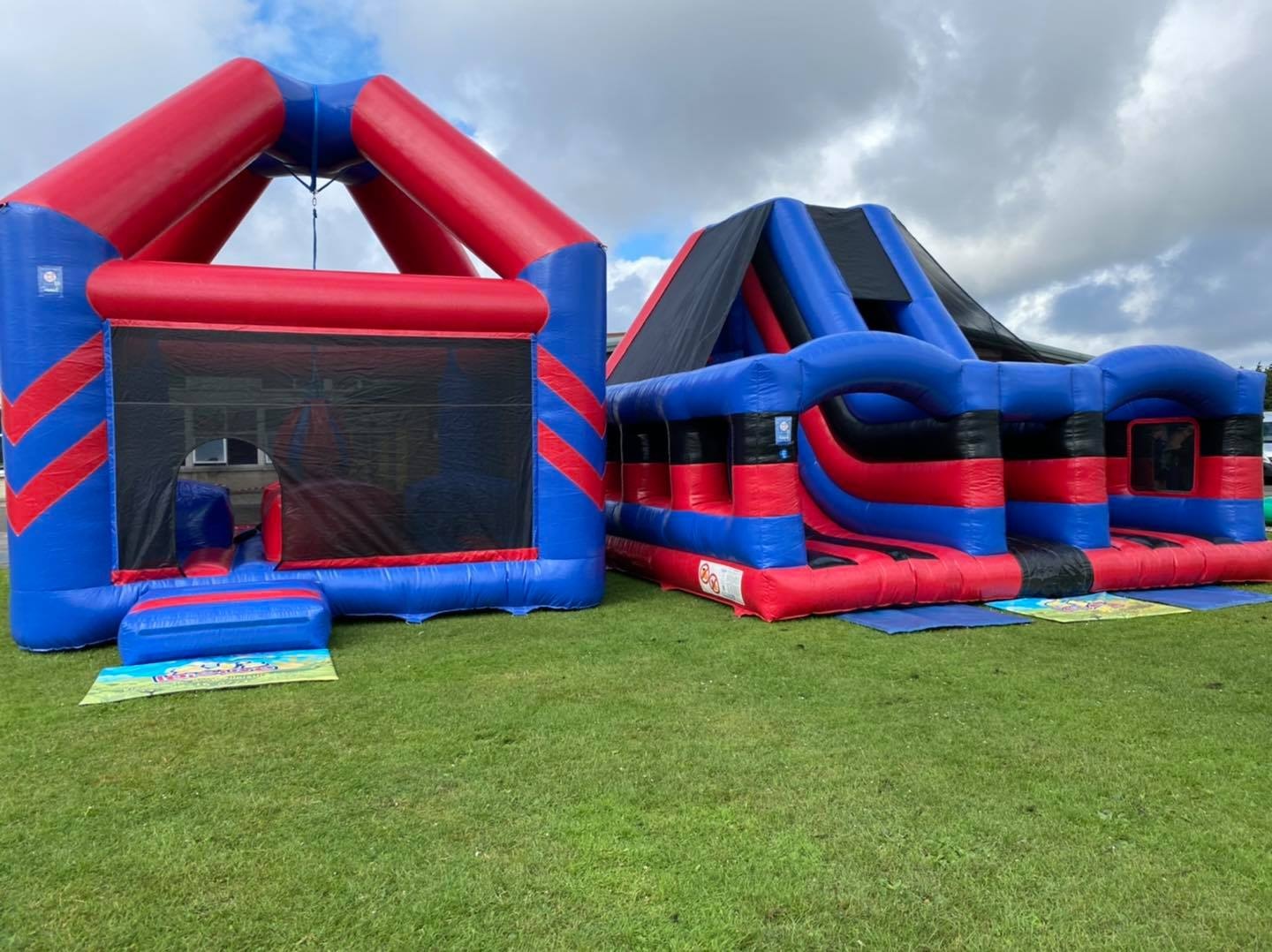 Enclosed demolition zone and super rock climb and slide set up in Liverpool for a school fun day.
