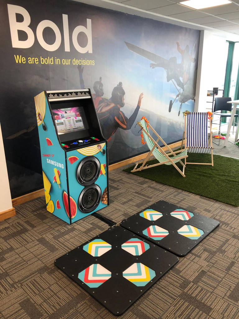 This image shows a custom branded arcade dance machine