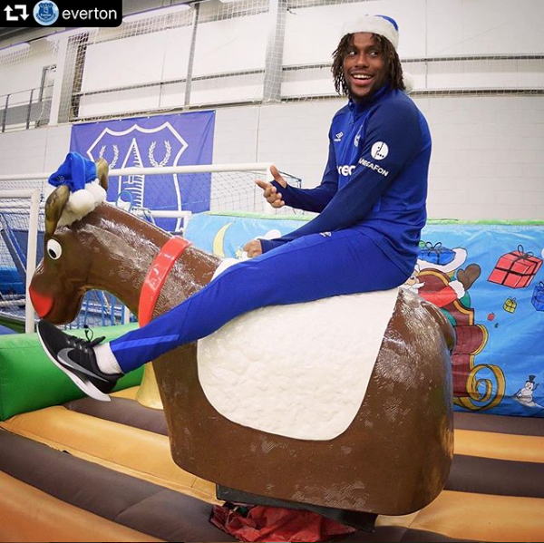 This image shows Alex Iwobi on an SJ's Leisure rodeo reindeer ride at the fan's Christmas party 2019. Alex Iwobi of Everton FC on an SJ's Leisure rodeo reindeer ride