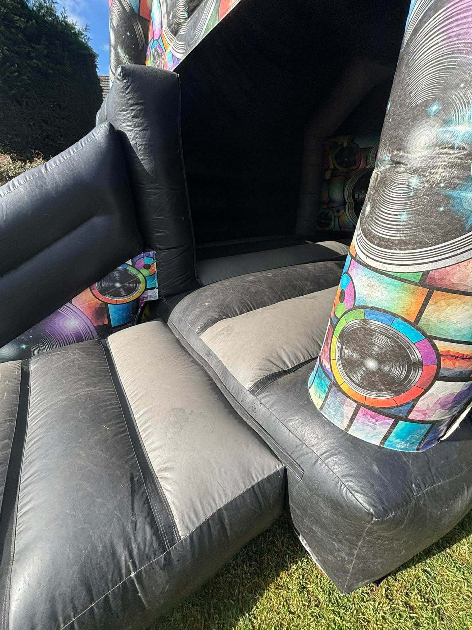 An image of a badly worn bouncy castle